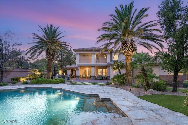 2285 Villefort Ct, Las Vegas, NV 89117 - back of house at dusk with a patio area and stucco siding