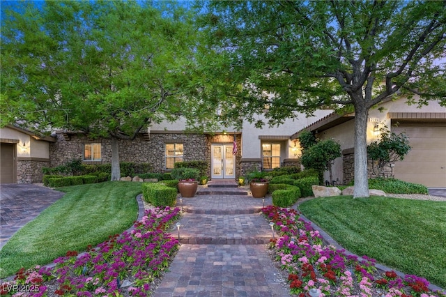 2285 Villefort Ct, Las Vegas, NV 89117 - view of front facade with french doors, stucco siding, stone siding, and a front yard