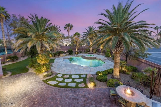 2285 Villefort Ct, Las Vegas, NV 89117 - view of pool with an outdoor fire pit, a patio area, a fenced backyard, and a pool with connected hot tub