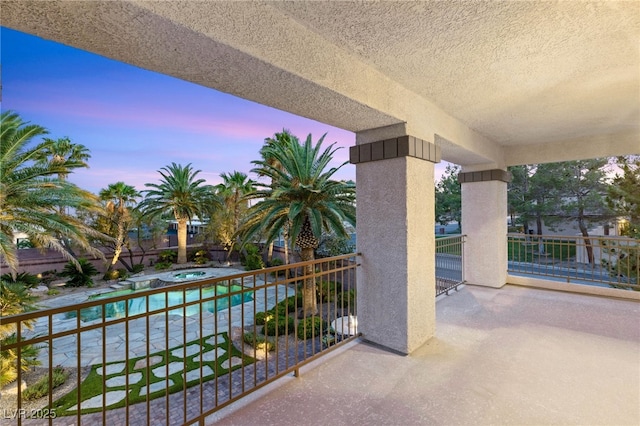 2285 Villefort Ct, Las Vegas, NV 89117 - balcony at dusk with an in-ground hot tub and view of pool