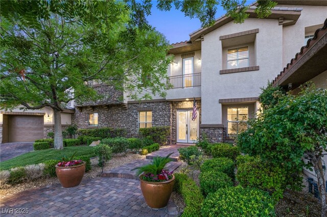 2285 Villefort Ct, Las Vegas, NV 89117 - view of front of home featuring stucco siding and stone siding