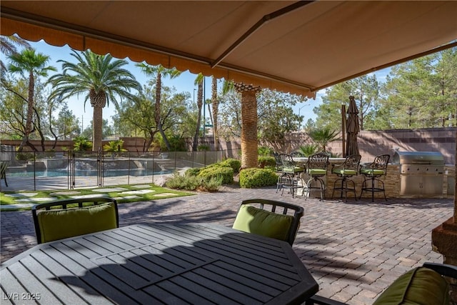 2285 Villefort Ct, Las Vegas, NV 89117 - view of patio with outdoor dining area, a pool, and area for grilling