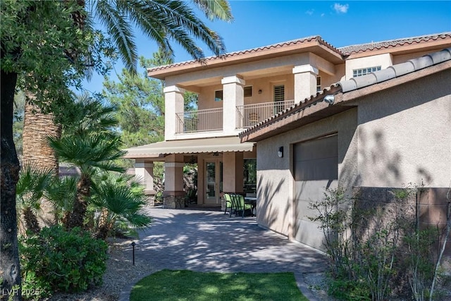 2285 Villefort Ct, Las Vegas, NV 89117 - mediterranean / spanish home featuring a balcony, stucco siding, a patio, and a tile roof