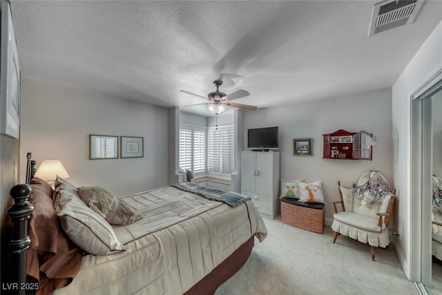 4045 N Chieftain St, Las Vegas, NV 89129 - bedroom featuring light carpet, a textured ceiling, and a ceiling fan