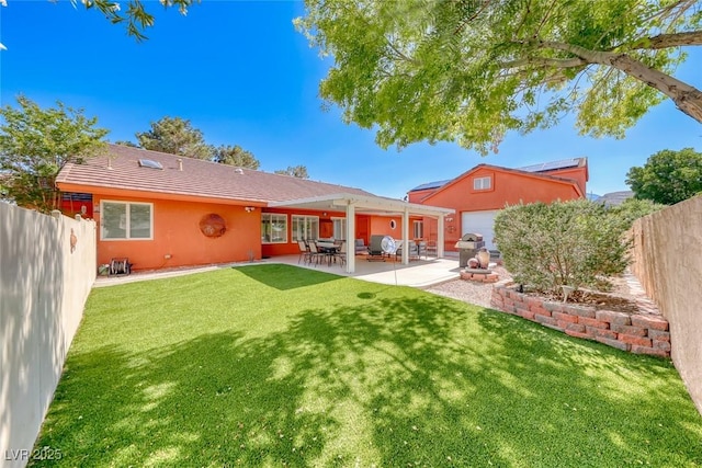 4045 N Chieftain St, Las Vegas, NV 89129 - rear view of property with a fenced backyard, a patio, and stucco siding