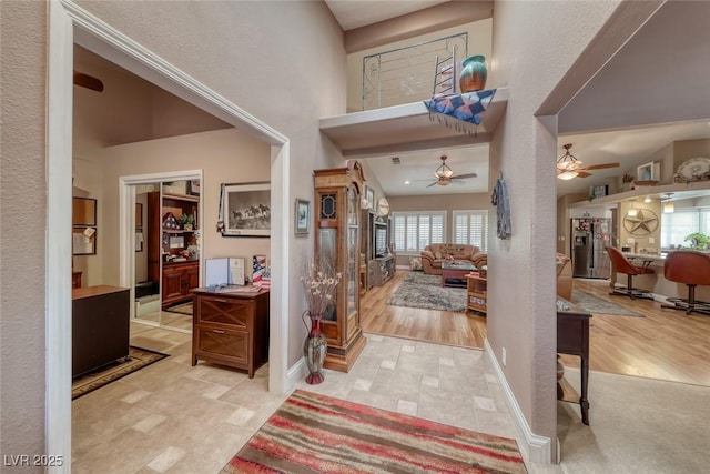 4045 N Chieftain St, Las Vegas, NV 89129 - foyer featuring ceiling fan, a high ceiling, and a textured wall