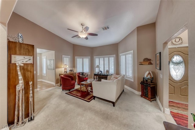 4045 N Chieftain St, Las Vegas, NV 89129 - living area with light colored carpet, ceiling fan, plenty of natural light, and lofted ceiling