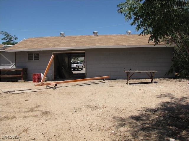 4950 Burnham Ave, Las Vegas, NV 89119 - rear view of house with roof with shingles and concrete block siding