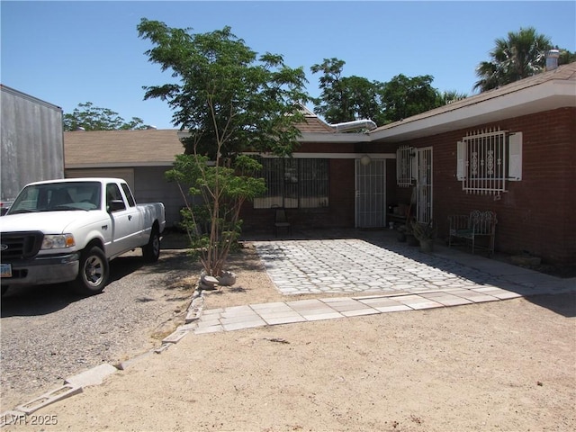 4950 Burnham Ave, Las Vegas, NV 89119 - view of front facade featuring brick siding