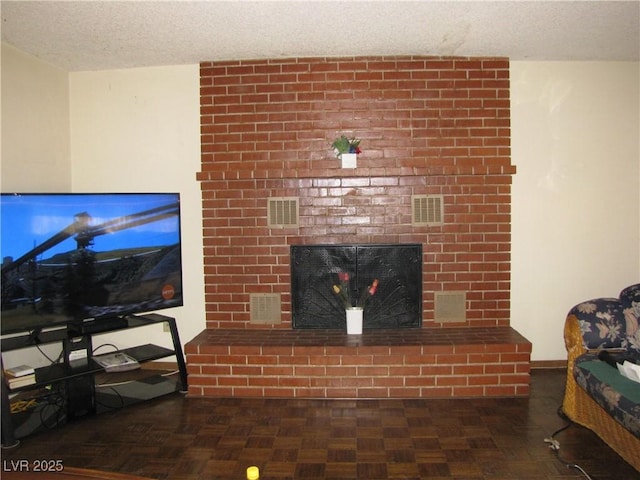 4950 Burnham Ave, Las Vegas, NV 89119 - living room with a fireplace and a textured ceiling