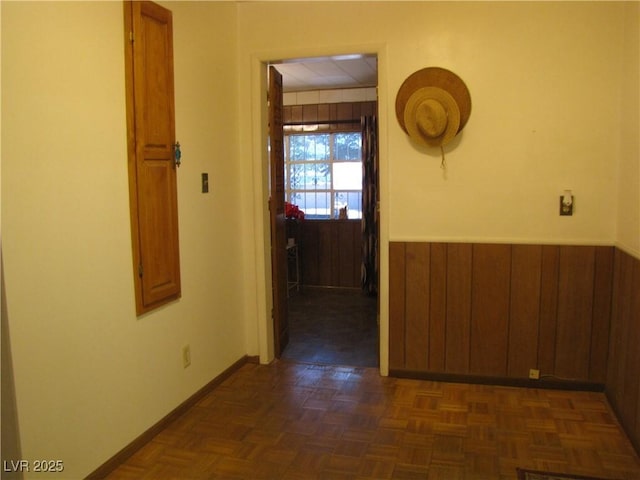 4950 Burnham Ave, Las Vegas, NV 89119 - hallway featuring wooden walls and baseboards
