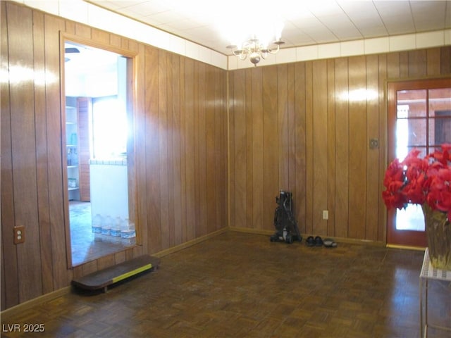4950 Burnham Ave, Las Vegas, NV 89119 - empty room with a chandelier and wood walls