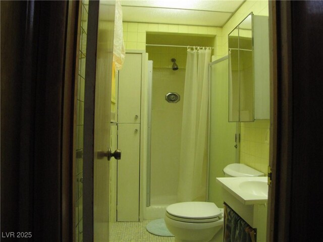 4950 Burnham Ave, Las Vegas, NV 89119 - full bathroom with a stall shower, tile patterned flooring, and vanity