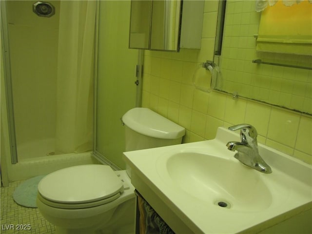 4950 Burnham Ave, Las Vegas, NV 89119 - full bathroom featuring a shower stall, vanity, and decorative backsplash