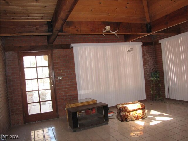 4950 Burnham Ave, Las Vegas, NV 89119 - interior space with brick wall, a wood ceiling with exposed beams, and tile patterned flooring