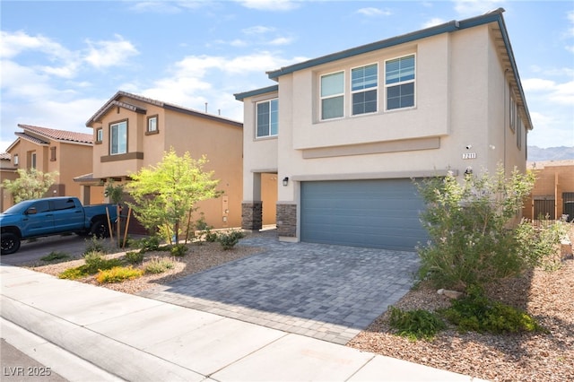 7211 Alabaster Peak St, Las Vegas, NV 89166 - view of front of house with stucco siding, decorative driveway, and an attached garage