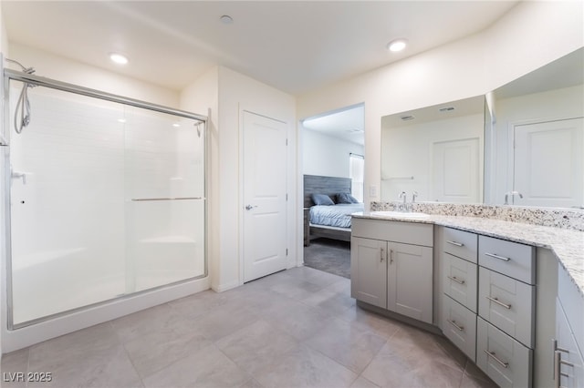 7211 Alabaster Peak St, Las Vegas, NV 89166 - ensuite bathroom featuring a stall shower, vanity, recessed lighting, and tile patterned floors