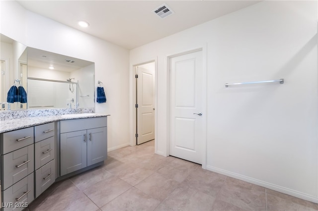 7211 Alabaster Peak St, Las Vegas, NV 89166 - bathroom with vanity, a stall shower, and tile patterned floors