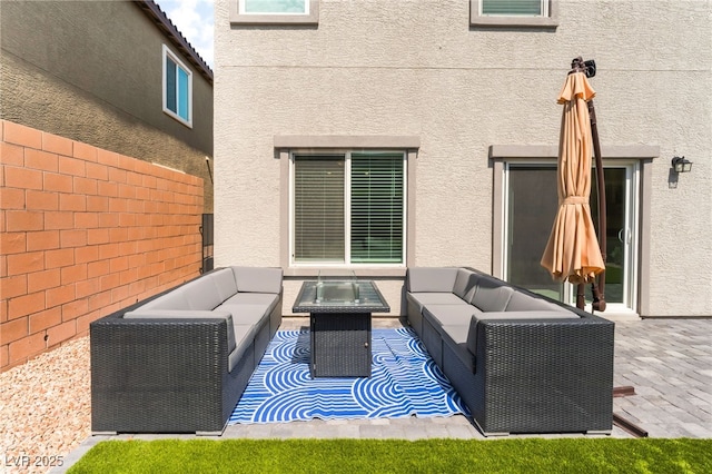 7211 Alabaster Peak St, Las Vegas, NV 89166 - view of patio with an outdoor living space with a fire pit