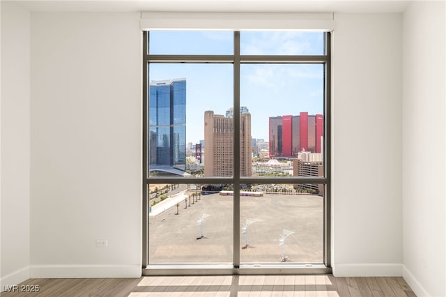 200 W Sahara Ave Unit 2204, Las Vegas, NV 89102 - unfurnished room featuring wood finished floors and a view of skyline