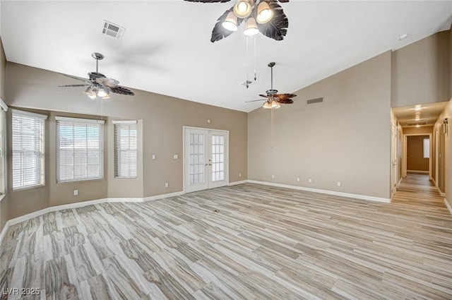 819 Sandsprings St, Henderson, NV 89011 - unfurnished living room with a ceiling fan, light wood finished floors, and high vaulted ceiling