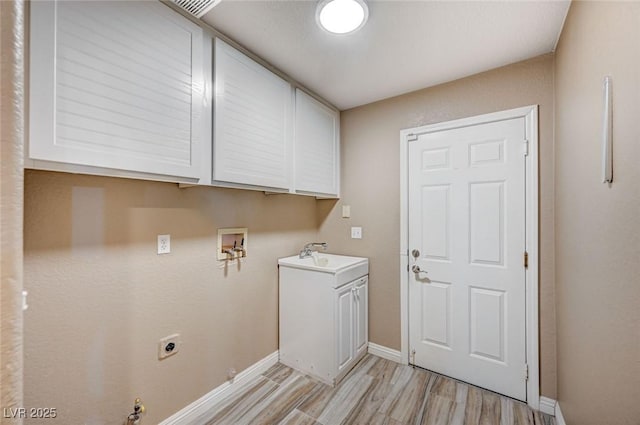 819 Sandsprings St, Henderson, NV 89011 - washroom with cabinet space, light wood-style flooring, electric dryer hookup, and washer hookup