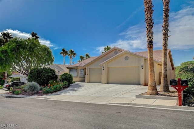 819 Sandsprings St, Henderson, NV 89011 - view of front of property with an attached garage, stucco siding, and concrete driveway