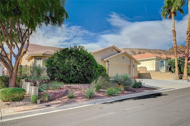 819 Sandsprings St, Henderson, NV 89011 - view of front of house with stucco siding, an attached garage, and concrete driveway
