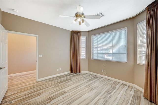 819 Sandsprings St, Henderson, NV 89011 - unfurnished room with light wood finished floors, a ceiling fan, and a smoke detector