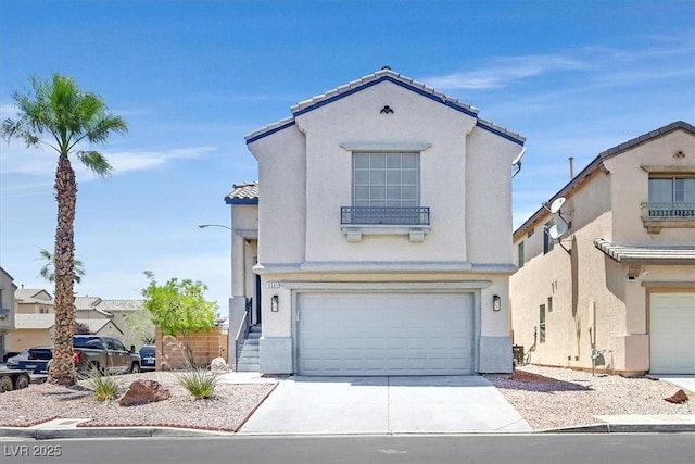 3591 Gloucester Gate St, Las Vegas, NV 89122 - mediterranean / spanish-style home featuring an attached garage, stucco siding, concrete driveway, and a tile roof