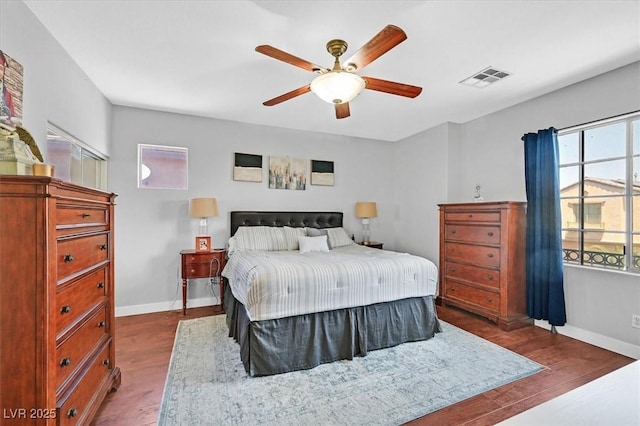3591 Gloucester Gate St, Las Vegas, NV 89122 - bedroom with dark wood-type flooring and ceiling fan