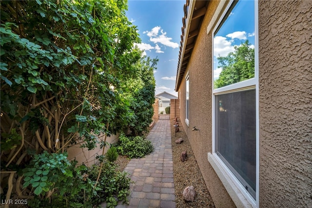 8346 Vinamala Ave, Las Vegas, NV 89149 - view of side of home featuring stucco siding