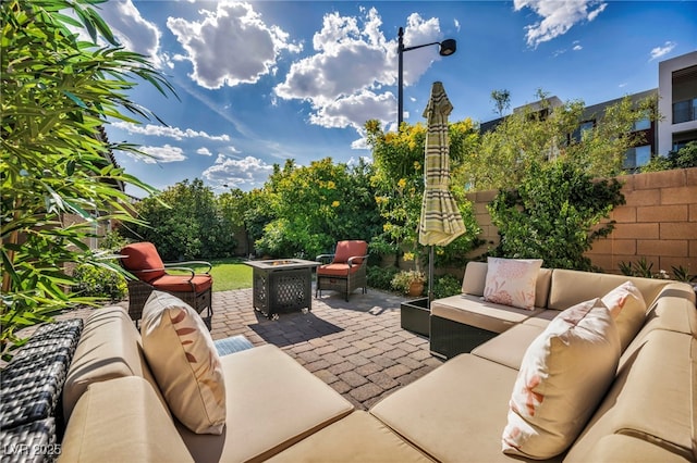 8346 Vinamala Ave, Las Vegas, NV 89149 - view of patio featuring an outdoor living space with a fire pit