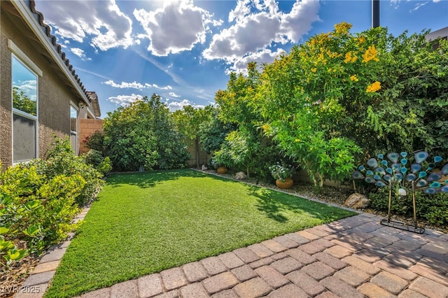 8346 Vinamala Ave, Las Vegas, NV 89149 - fenced backyard featuring a patio area