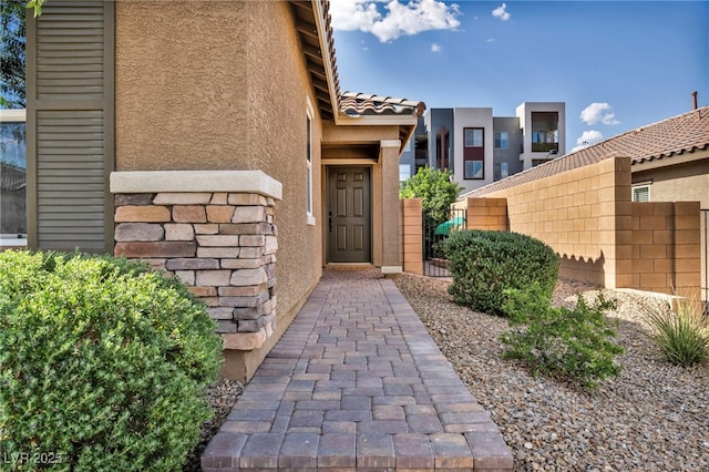 8346 Vinamala Ave, Las Vegas, NV 89149 - view of exterior entry featuring stucco siding and a tile roof