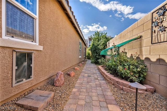8346 Vinamala Ave, Las Vegas, NV 89149 - view of side of home with stucco siding