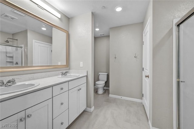 8346 Vinamala Ave, Las Vegas, NV 89149 - full bathroom featuring a shower stall, double vanity, and recessed lighting