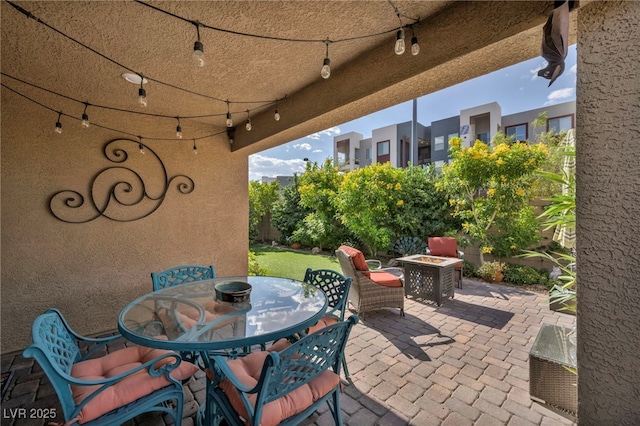 8346 Vinamala Ave, Las Vegas, NV 89149 - view of patio with a fire pit and outdoor dining area