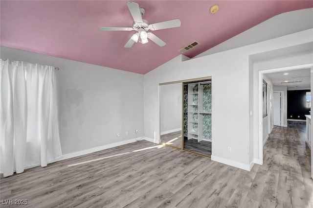 5823 Rose Sage St, North Las Vegas, NV 89031 - unfurnished room with vaulted ceiling, wood finished floors, and a ceiling fan