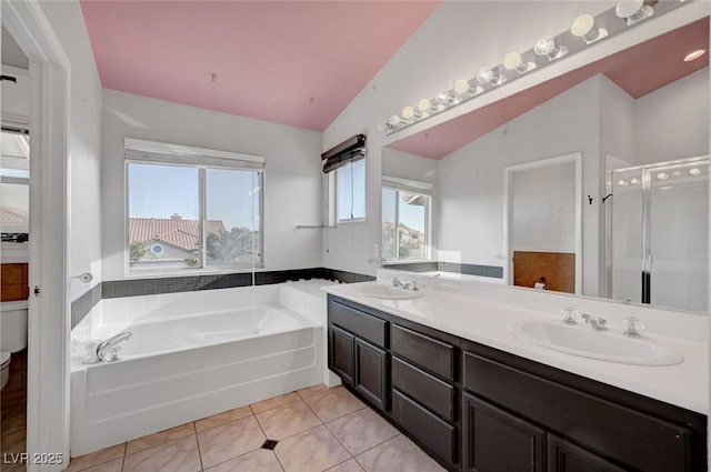 5823 Rose Sage St, North Las Vegas, NV 89031 - full bathroom with a garden tub, lofted ceiling, double vanity, tile patterned floors, and a shower stall