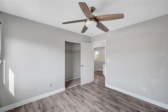 5823 Rose Sage St, North Las Vegas, NV 89031 - unfurnished bedroom featuring wood finished floors, a closet, and a ceiling fan
