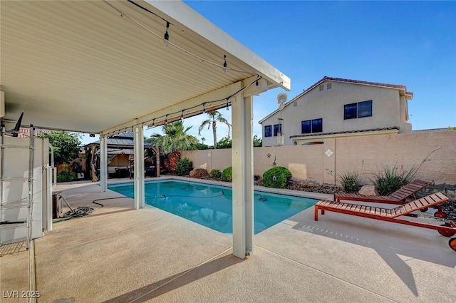 5823 Rose Sage St, North Las Vegas, NV 89031 - view of swimming pool with a patio and a fenced backyard