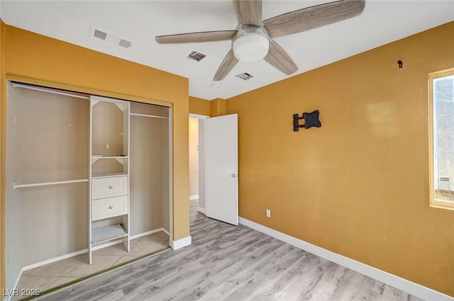 5823 Rose Sage St, North Las Vegas, NV 89031 - unfurnished bedroom with light wood finished floors, a closet, and a ceiling fan