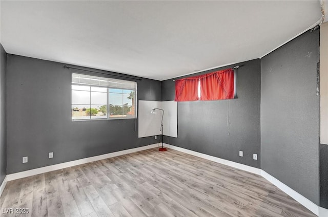5823 Rose Sage St, North Las Vegas, NV 89031 - empty room with light wood finished floors