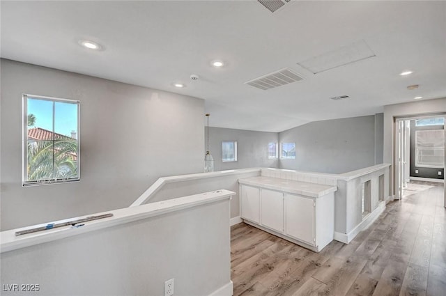 5823 Rose Sage St, North Las Vegas, NV 89031 - hall featuring light wood-type flooring, healthy amount of natural light, an upstairs landing, and recessed lighting