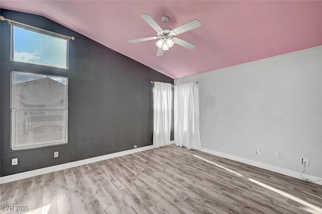 5823 Rose Sage St, North Las Vegas, NV 89031 - empty room with vaulted ceiling, wood finished floors, and a ceiling fan