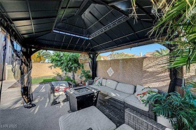 5823 Rose Sage St, North Las Vegas, NV 89031 - fenced backyard featuring an outdoor living space with a fire pit, a patio, and a gazebo
