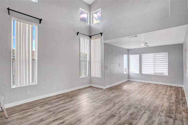5823 Rose Sage St, North Las Vegas, NV 89031 - empty room with wood finished floors and baseboards