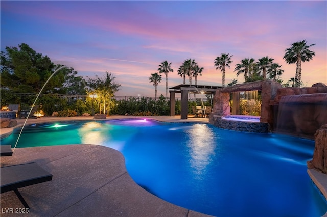 352 Angels Trace Ct, Las Vegas, NV 89148 - pool at dusk featuring a gazebo, a pool with connected hot tub, and a patio