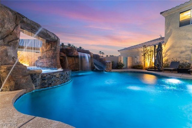 352 Angels Trace Ct, Las Vegas, NV 89148 - pool at dusk featuring a water slide